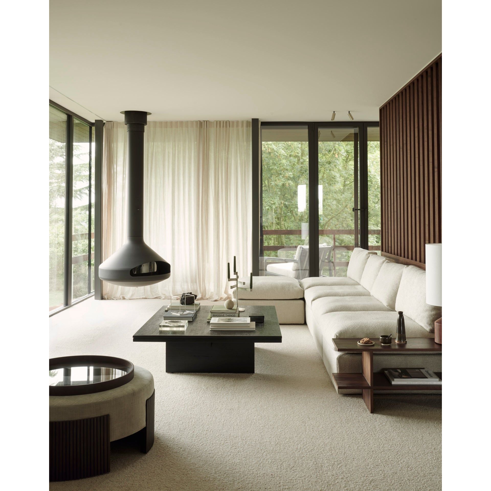 Featuring Roller Mahogany Dark Brown Max Pouf by Ethnicraft at Amethyst Home. The Roller Max collection is remarkable in its design, distinguished with its stacked wood-stick effect. The pouf is a multifunctional item which encapsulates the comfortable upholstery cushion within the dark brown-varnished mahogany.Weight : 37 lbs Dimensions: 33.5" W x 33.5" L.  Amethyst Home provides interior design, new home construction design consulting, vintage area rugs, and lighting in the Calabasas metro area.