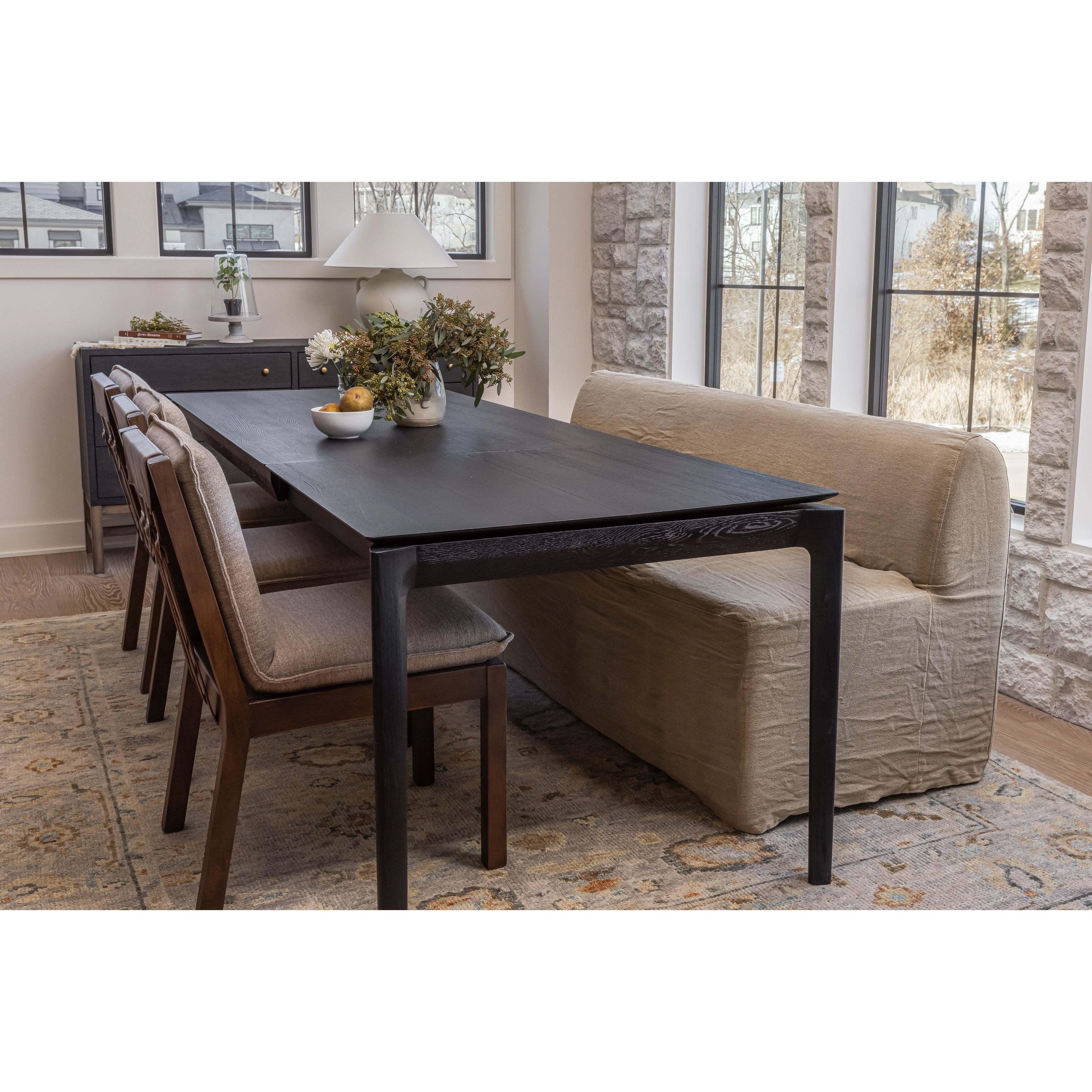 Featuring Wilmington Alcala Fawn Dining Chair by Four Hands at Amethyst Home. An Amethyst fave -- the Wilmington dining chair has a gorgeous coffee colored textile paired with medium toned wood and interesting leather buckles on the back -- we tied in the gold buckles with the gold chandelier above!  Inspired by the folded pillow form, the seat and back. Amethyst Home provides interior design, new home construction design consulting, vintage area rugs, and lighting in the Newport Beach metro area.