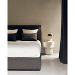 Featuring Revive Removable Linen Cover Grey Bed by Ethnicraft at Amethyst Home. Find solace in the Revive bed, where comfort meets practicality. Its linen headboard, effortlessly removable for dry cleaning, ensures a fresh and inviting space. Stitched details add a touch of refined elegance and create a soft backdrop that whispers tranquility into the bed.  Amethyst Home provides interior design, new home construction design consulting, vintage area rugs, and lighting in the Washington metro area.