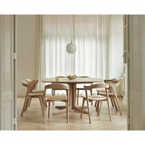 Featuring Corto Square White Oak Dining Table by Ethnicraft at Amethyst Home. Inspired by the vaults within grand architectural designs, the Corto's central-footed base provides both visual interest and practical stability with less leg disturbance for your guests. The solid oak tabletop is crafted into the perfect shape, with unique rounded corners to cre.  Amethyst Home provides interior design, new home construction design consulting, vintage area rugs, and lighting in the Park City metro area.