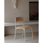 Featuring Pi Armless Oak Dining Chair by Ethnicraft at Amethyst Home. The PI collection honors nature’s design by keeping the strength, curves and lines, as nature intended. Interesting shapes are discovered in this sleek and stylish, polished imperfect, finish. Each PI item is finished by hand to ensure that the individual character of the wood is respec.  Amethyst Home provides interior design, new home construction design consulting, vintage area rugs, and lighting in the Washington metro area.