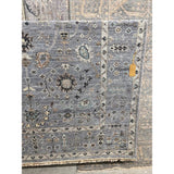 Featuring Rhapsody Nysa Hand-Knotted Rug by Jaipur Living at Amethyst Home. The Rhapsody collection features heirloom-quality designs of stunningly abrashed Old World patterns. The Nysa area rug boasts a beautifully washed floral motif with a decorative border. The blue tone is accented with rich green, tan, navy, and cream hues for added depth and intrigu.  Amethyst Home provides interior design, new home construction design consulting, vintage area rugs, and lighting in the Park City metro area.