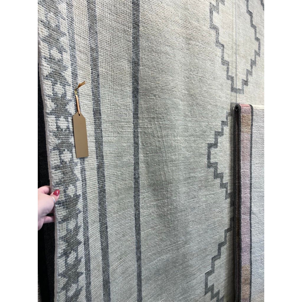 Featuring Cyprus Green Paphos Hand-Knotted Rug by Jaipur Living at Amethyst Home. The hand-knotted Cyprus collection showcases a modern representation of vintage Kars designs with clean-lined geometric details and fresh colorways. The dark and light green Paphos design delights with a minimalistic medallion pattern and a similarly styled border. Low p.  Amethyst Home provides interior design, new home construction design consulting, vintage area rugs, and lighting in the Salt Lake City metro area.