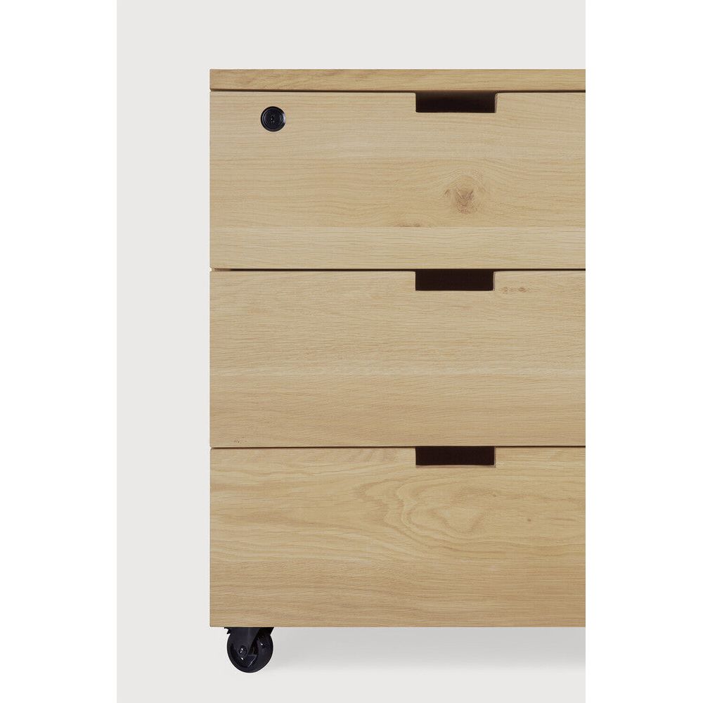 Featuring Billy Varnished Oak Drawer Unit by Ethnicraft at Amethyst Home. Organise your work space with the Billy drawer unit in solid oak. It features three soft-closing drawers and easy access thanks to the handy wheels. On its own or under a desk, it is the simple staple every office needs.Weight : 75 lb Dimensions: 22.5 in W x 20 in L x 24.5 in HBrushed : NoCollection : Billy. Amethyst Home provides interior design, new construction, custom furniture, and area rugs in the Des Moines metro area