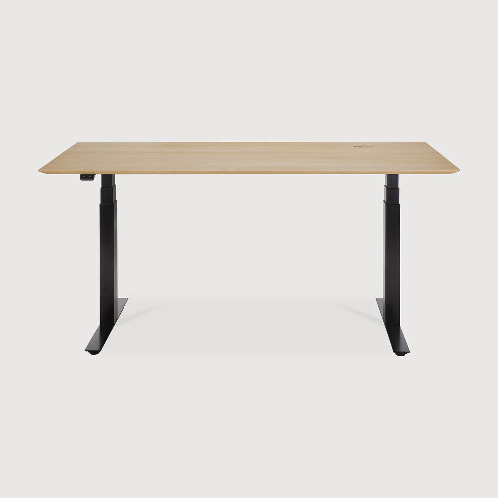 Featuring Bok Black Us Oak Adjustable Desk by Ethnicraft at Amethyst Home. The Bok adjustable desk was designed with the importance of health and good posture in mind. The motorised system in its legs allows the tabletop to be elevated to the height of your liking. That way, you can easily switch between sitting and standing throughout the workday. Choose between white or black me. Amethyst Home provides interior design, new construction, custom furniture, and area rugs in the Park City metro area