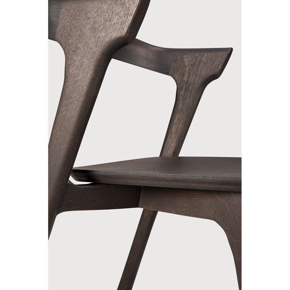 Over the years, the Bok dining chair has become one of our most recognisable designs. Designer Alain van Havre combines sculptural elegance and contemporary crafting into a graceful and airy form.
Seating height: 46cm - 18".
Made from brown tainted oak with a varnish finish. Amethyst Home provides interior design, new construction, custom furniture, and area rugs in the Portland metro area