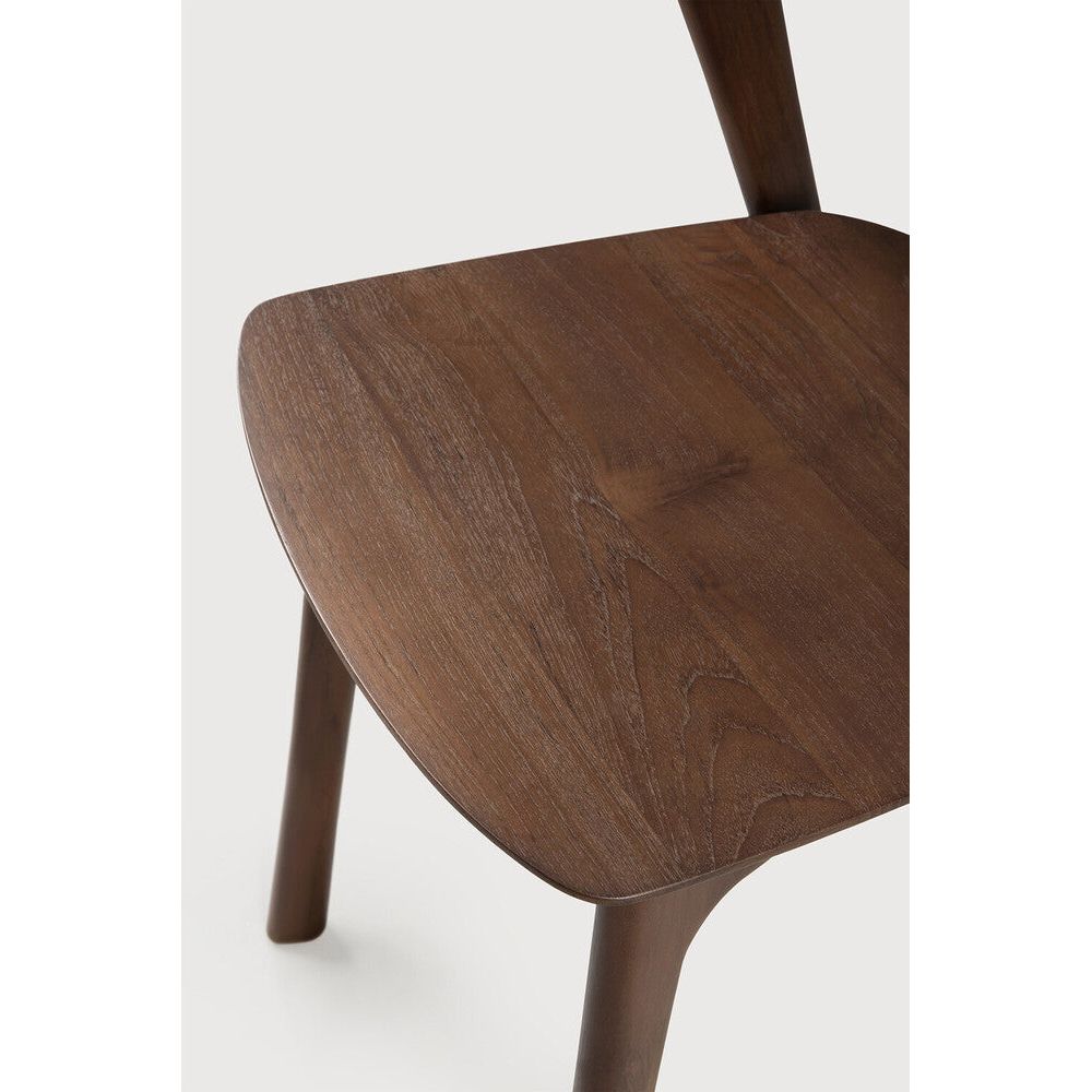Featuring Bok No Upholstery Varnished Teak Brown Dining Chair by Ethnicraft at Amethyst Home. Reminiscent of a goat's curved horns, the Bok collection combines sculptural elegance and contemporary crafting into a graceful and airy form. Over the years, the Bok dining chair has become one of Ethnicraft's most recognisable designs.Weight : 33 lb Dimensions: 24.5 in W x 23 in L x 35 in . Amethyst Home provides interior design, new construction, custom furniture, and area rugs in the Dallas metro area