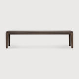 Featuring Bok Oak Brown Bench by Ethnicraft at Amethyst Home. Reminiscent of a goat's curved horns, the Bok collection combines sculptural elegance and contemporary crafting into a graceful and airy form. The Bok bench pairs well with the Bok dining table, but also as a stand-alone against a wall, in a hallway or at the end of a bed.Collection : BokFinish : VarnishedFloor Prot. Amethyst Home provides interior design, new construction, custom furniture, and area rugs in the Newport Beach metro area