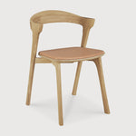 Featuring Bok Sienna Leather Varnished Oak Dining Chair by Ethnicraft at Amethyst Home. Reminiscent of a goat's curved horns, the Bok collection combines sculptural elegance and contemporary crafting into a graceful and airy form. Over the years, the Bok dining chair has become one of Ethnicraft's most recognisable designs.Weight : 15 lbs Dimensions: 21.5" W x 20" L x 30" H. Amethyst Home provides interior design, new construction, custom furniture, and area rugs in the Austin metro area