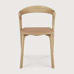 Featuring Bok Sienna Leather Varnished Oak Dining Chair by Ethnicraft at Amethyst Home. Reminiscent of a goat's curved horns, the Bok collection combines sculptural elegance and contemporary crafting into a graceful and airy form. Over the years, the Bok dining chair has become one of Ethnicraft's most recognisable designs.Weight : 15 lbs Dimensions: 21.5" W x 20" L x 30" H. Amethyst Home provides interior design, new construction, custom furniture, and area rugs in the Houston metro area