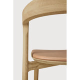 Featuring Bok Sienna Leather Varnished Oak Dining Chair by Ethnicraft at Amethyst Home. Reminiscent of a goat's curved horns, the Bok collection combines sculptural elegance and contemporary crafting into a graceful and airy form. Over the years, the Bok dining chair has become one of Ethnicraft's most recognisable designs.Weight : 15 lbs Dimensions: 21.5" W x 20" L x 30" H. Amethyst Home provides interior design, new construction, custom furniture, and area rugs in the Kansas City metro area