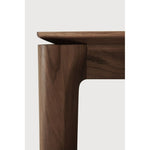 Featuring Bok Varnished Teak Brown Dining Table by Ethnicraft at Amethyst Home. Reminiscent of a goat's curved horns, the Bok collection combines sculptural elegance and contemporary crafting into a graceful and airy form. Just like its matching chair, the Bok dining table has become one of our signature designs. A timeless design to enjoy for years to come.Adjustable Feet : NoBru. Amethyst Home provides interior design, new construction, custom furniture, and area rugs in the Charlotte metro area