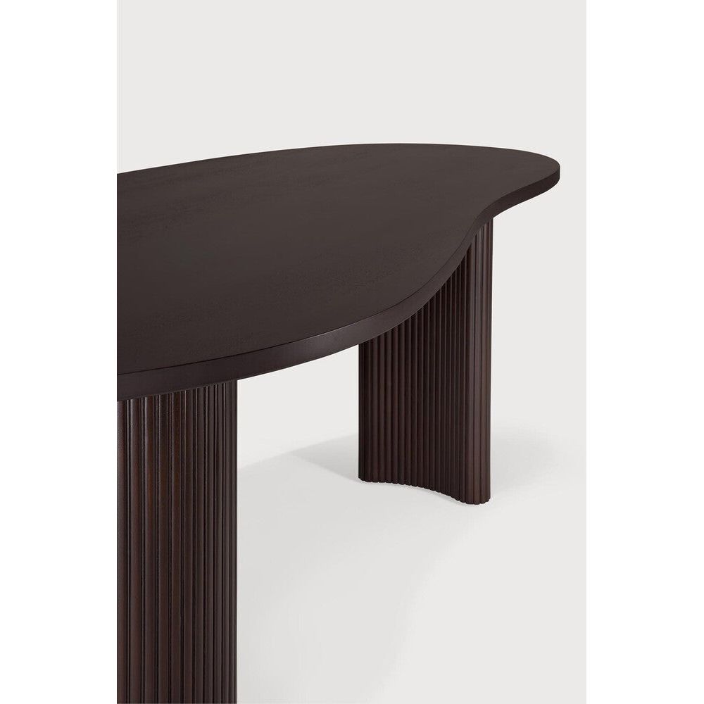 Featuring Boomerang Mahogany Dark Brown Desk by Ethnicraft at Amethyst Home. Inspired by shapes found in nature, the Boomerang collection features a playful, pebble top set on curved legs with a stacked, wood stick effect. The Boomerang desk is a statement piece for any workspace with its organic, eye-catching design unique for the office.Weight : 91 lbs Dimensions: 39.5" W x 79" L x . Amethyst Home provides interior design, new construction, custom furniture, and area rugs in the Miami metro area