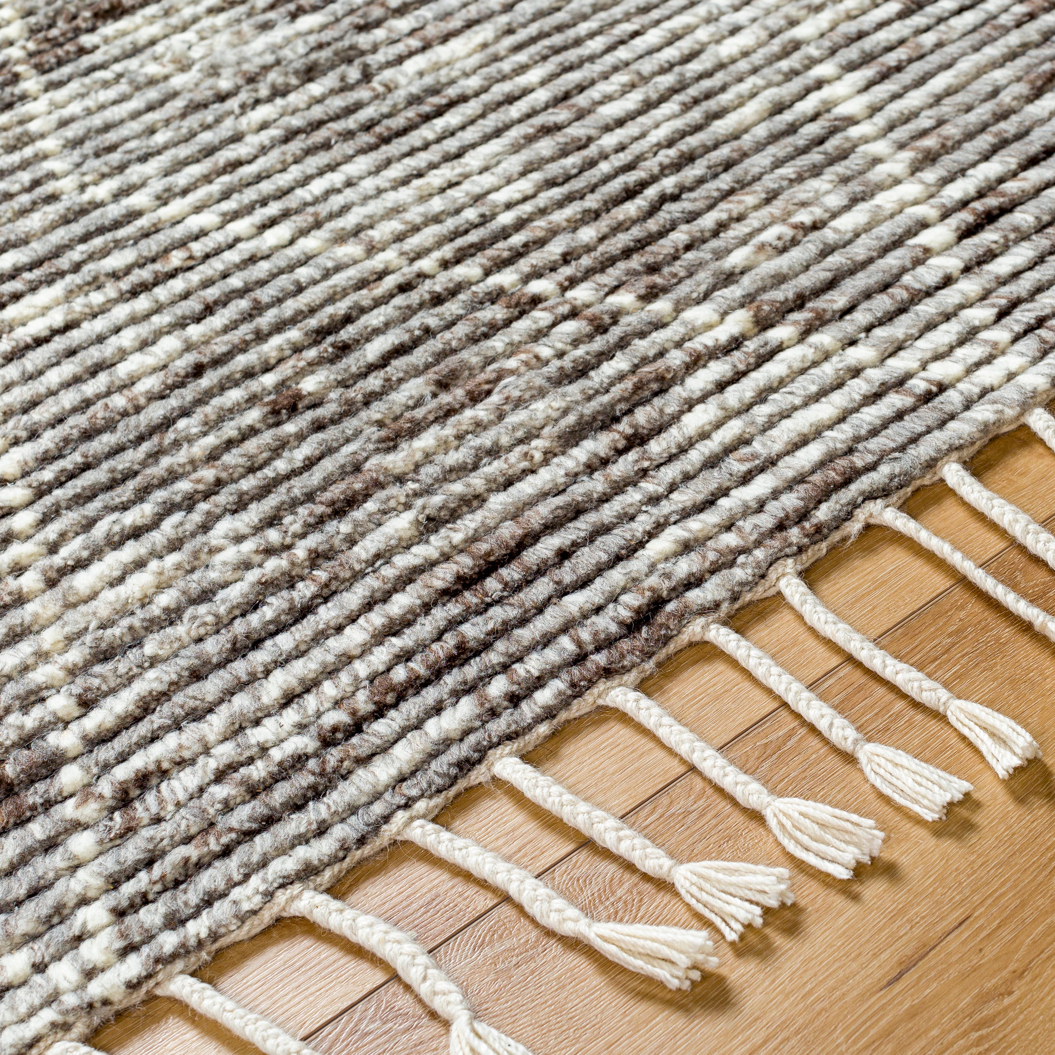 Featuring Camille Jasper Wolf Hand-Knotted Rug by Surya at Amethyst Home. The Camille Jasper Wolf hand-knotted rug features a yummy blend of charcoal greys and chocolate brown.  Soft to the touch and made of dreamy, knotted wool in a low shed blend.
Hand-Knotted100% WoolFringe Length: 5"Rug Thickness: 0.75". Amethyst Home provides interior design, new home construction design consulting, vintage area rugs, and lighting in the Portland metro area.