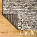 Featuring Camille Jasper Wolf Hand-Knotted Rug by Surya at Amethyst Home. The Camille Jasper Wolf hand-knotted rug features a yummy blend of charcoal greys and chocolate brown.  Soft to the touch and made of dreamy, knotted wool in a low shed blend.
Hand-Knotted100% WoolFringe Length: 5"Rug Thickness: 0.75". Amethyst Home provides interior design, new home construction design consulting, vintage area rugs, and lighting in the Seattle metro area.