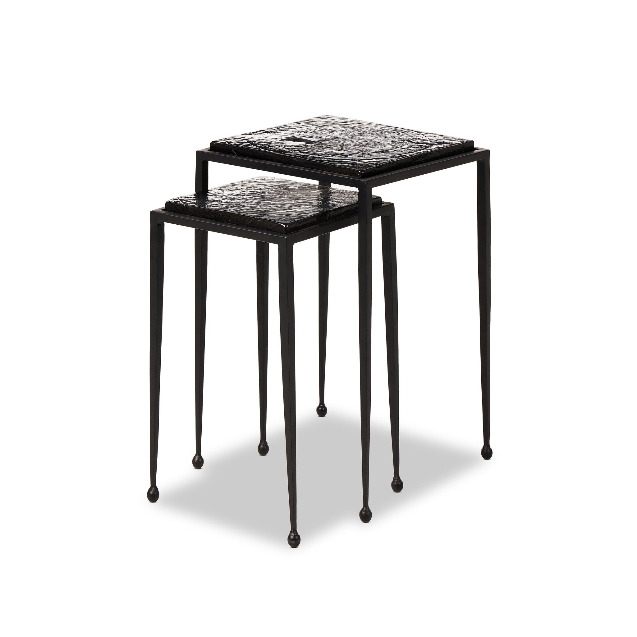 Featuring Dexter Smoked Black Cast Glass Nesting Tables by Four Hands at Amethyst Home. Embrace the mysterious with the Dexter smoked glass nesting tables.  Beautiful smoked glass gives a warm modern vibe while being practical.Overall Dimensions: 16.25"w x 16.25"d x 21.00"hWeight : 52.91 lbsMaterials : Cast Glass, Iron. Amethyst Home provides interior design, new construction, custom furniture, and area rugs in the Calabasas metro area