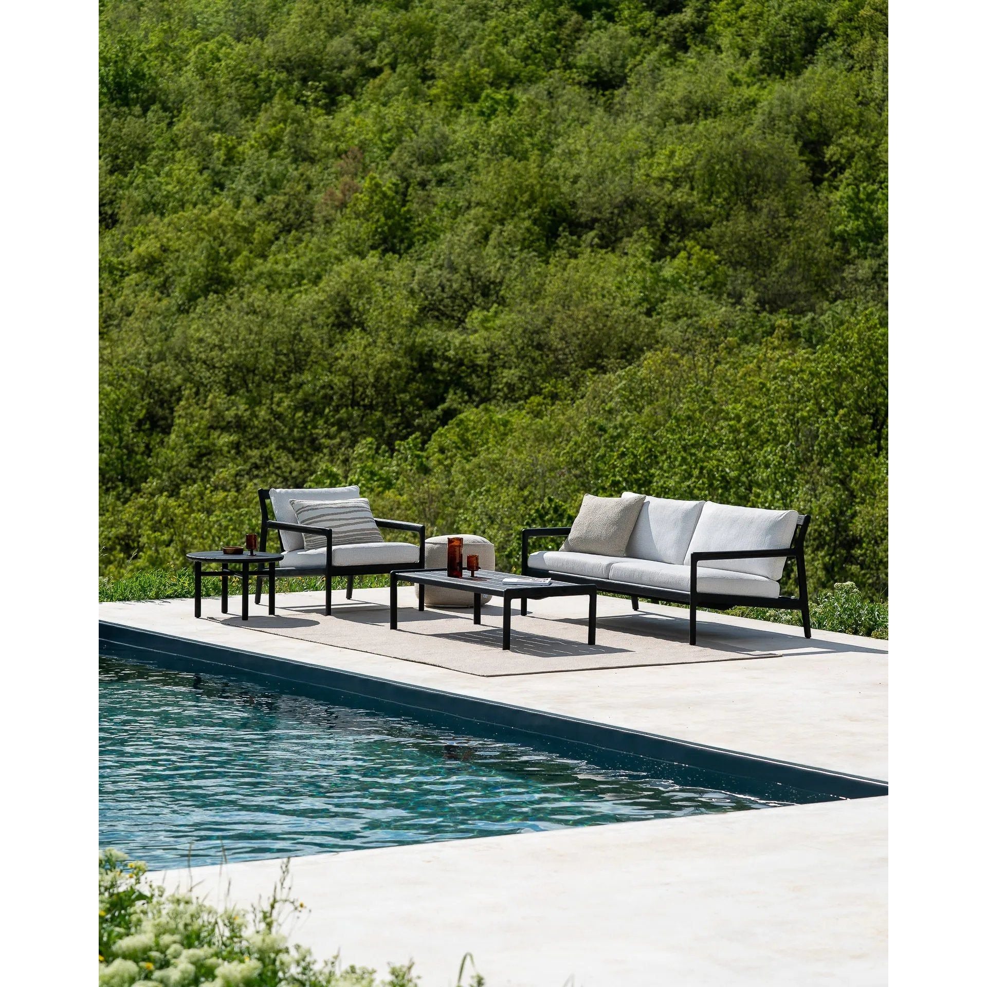 Featuring Jack Teak Black Outdoor Coffee Table by Ethnicraft at Amethyst Home. Alluring from every angle, luxuriant shapes and curves form the basis of the Jack collection. Designed to attract attention with the same clean and classic lines, place the Jack coffee table as a single item or arranged together in a composition specific to your needs.Brushed. Amethyst Home provides interior design, new home construction design consulting, vintage area rugs, and lighting in the Newport Beach metro area.