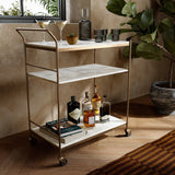 Featuring Tatum Antique Brass Rectangular Bar Cart by Four Hands at Amethyst Home. Entertain with style.  Beautiful natural marble shelves with a brass frame instantly infuses your space with style.Overall Dimensions: 30.00"w x 16.00"d x 36.25"hWeight : 85.98 lbsMaterials : Iron, Solid Marble. Amethyst Home provides interior design, new construction, custom furniture, and area rugs in the Winter Garden metro area