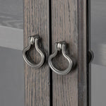 Baroque-period detailing gives this oak cabinet its  classic look. Made from black oak with a metal base and ring pulls, as well as cabriole-like legs to soften the lines Amethyst Home provides interior design, new home construction design consulting, vintage area rugs, and lighting in the Charlotte metro area.