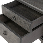 Baroque-period detailing gives this oak desk its  classic look. Made from worn black oak with metal ring pulls on its four drawers, as well as cabriole-like legs to soften the lines Amethyst Home provides interior design, new home construction design consulting, vintage area rugs, and lighting in the Dallas metro area.