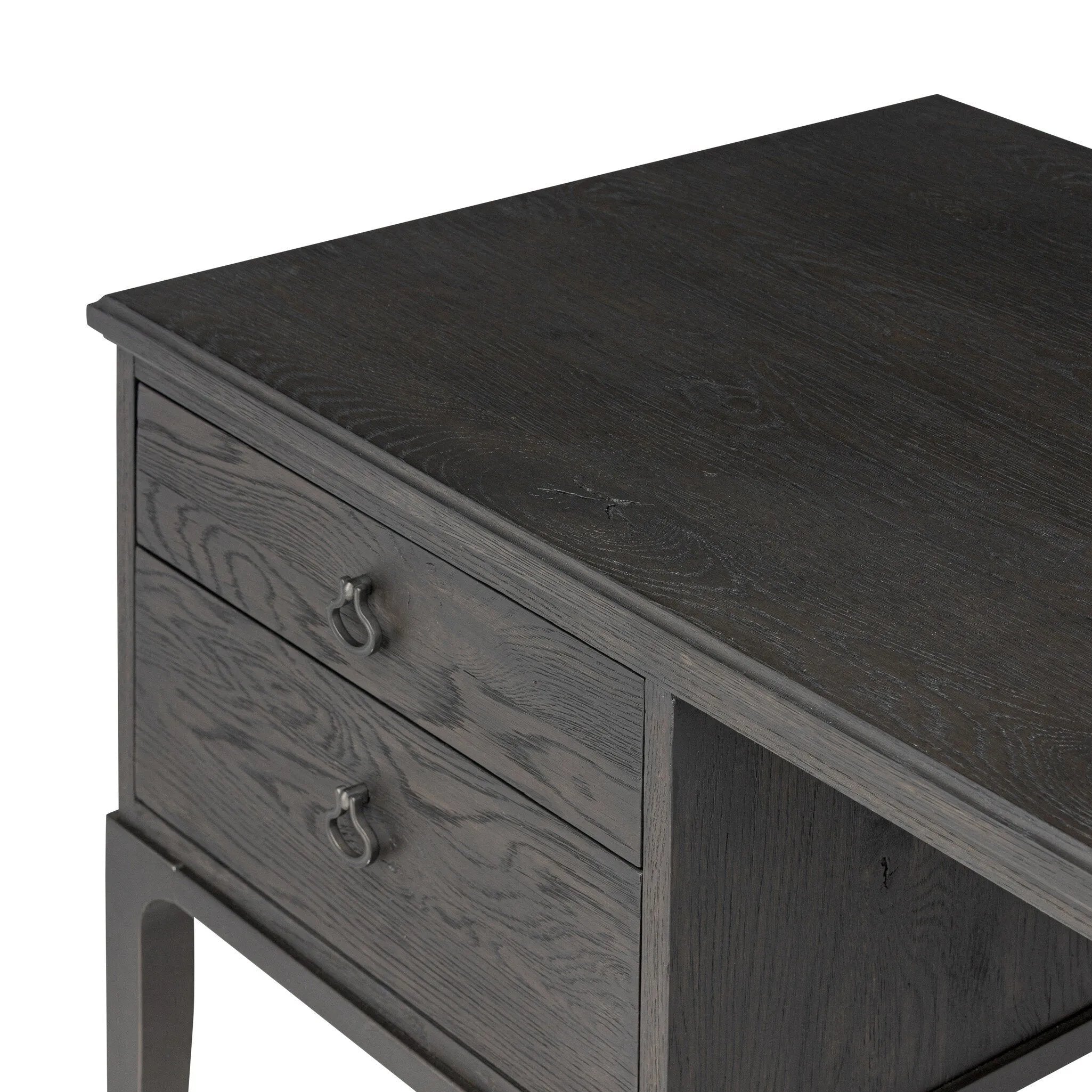 Baroque-period detailing gives this oak desk its  classic look. Made from worn black oak with metal ring pulls on its four drawers, as well as cabriole-like legs to soften the lines Amethyst Home provides interior design, new home construction design consulting, vintage area rugs, and lighting in the Laguna Beach metro area.