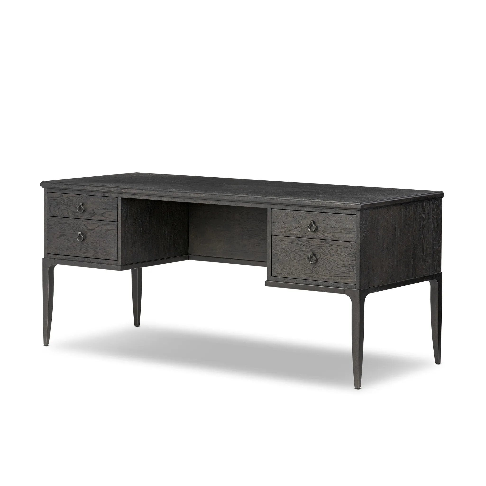 Baroque-period detailing gives this oak desk its  classic look. Made from worn black oak with metal ring pulls on its four drawers, as well as cabriole-like legs to soften the lines Amethyst Home provides interior design, new home construction design consulting, vintage area rugs, and lighting in the Nashville metro area.