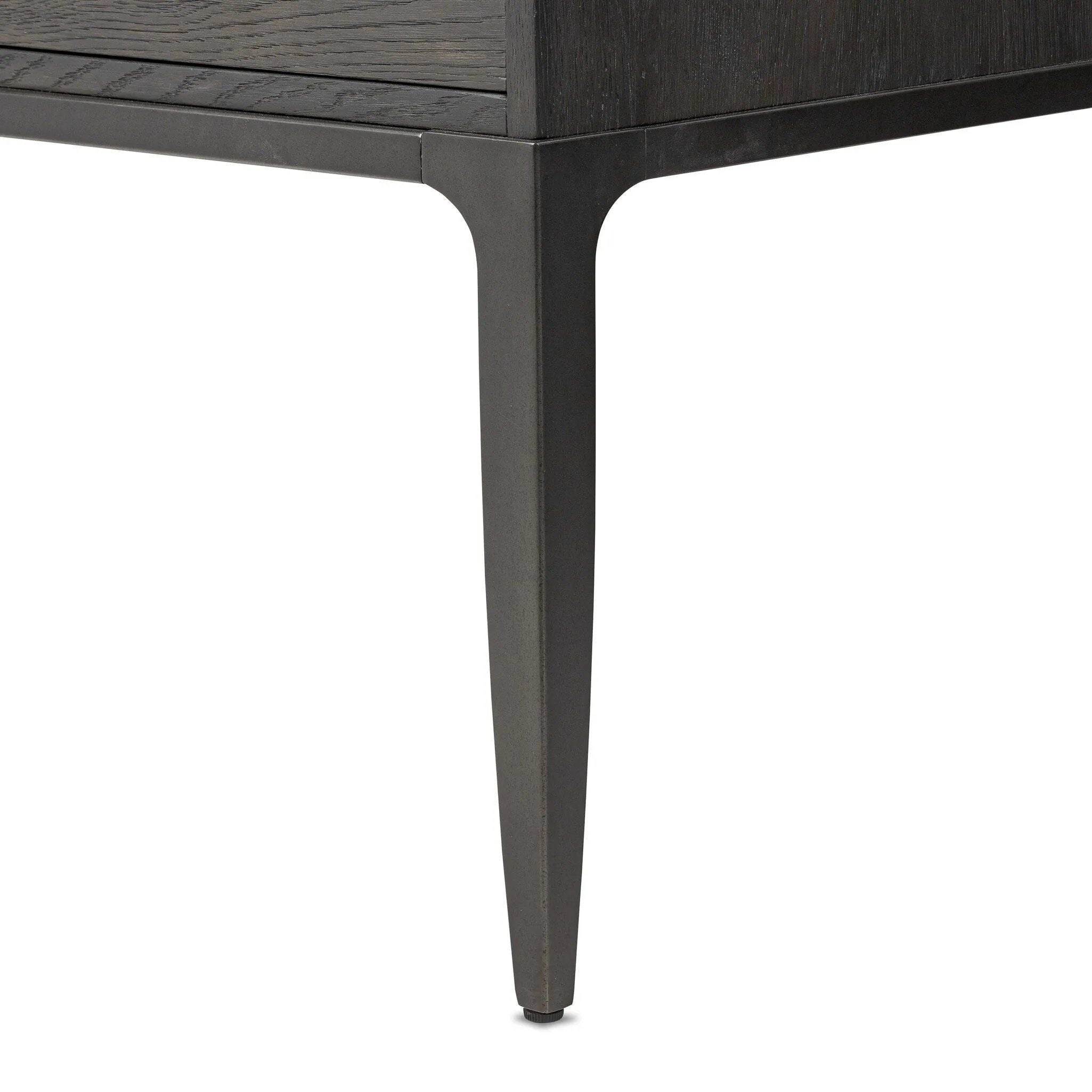 Baroque-period detailing gives this oak desk its  classic look. Made from worn black oak with metal ring pulls on its four drawers, as well as cabriole-like legs to soften the lines Amethyst Home provides interior design, new home construction design consulting, vintage area rugs, and lighting in the Omaha metro area.