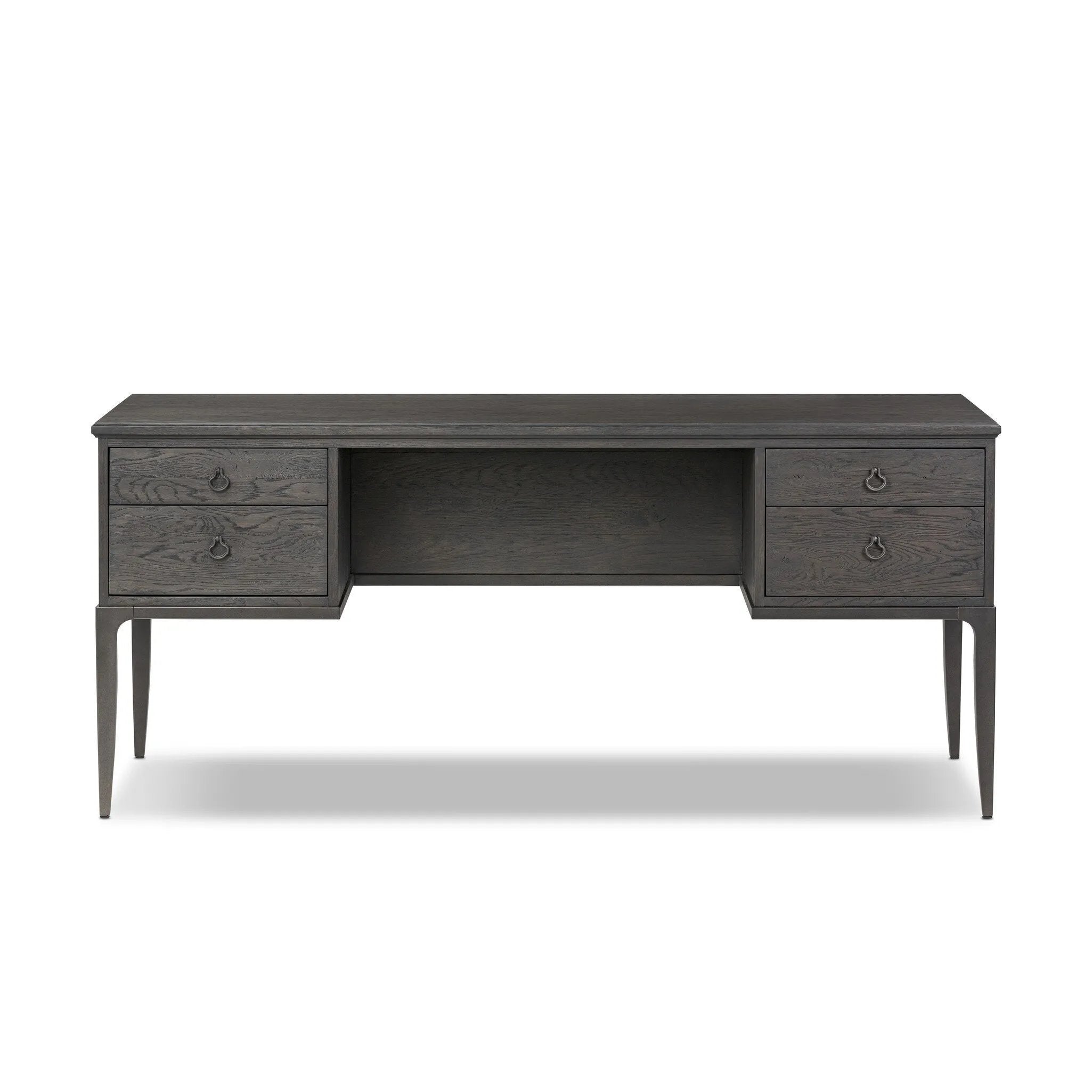 Baroque-period detailing gives this oak desk its  classic look. Made from worn black oak with metal ring pulls on its four drawers, as well as cabriole-like legs to soften the lines Amethyst Home provides interior design, new home construction design consulting, vintage area rugs, and lighting in the Salt Lake City metro area.