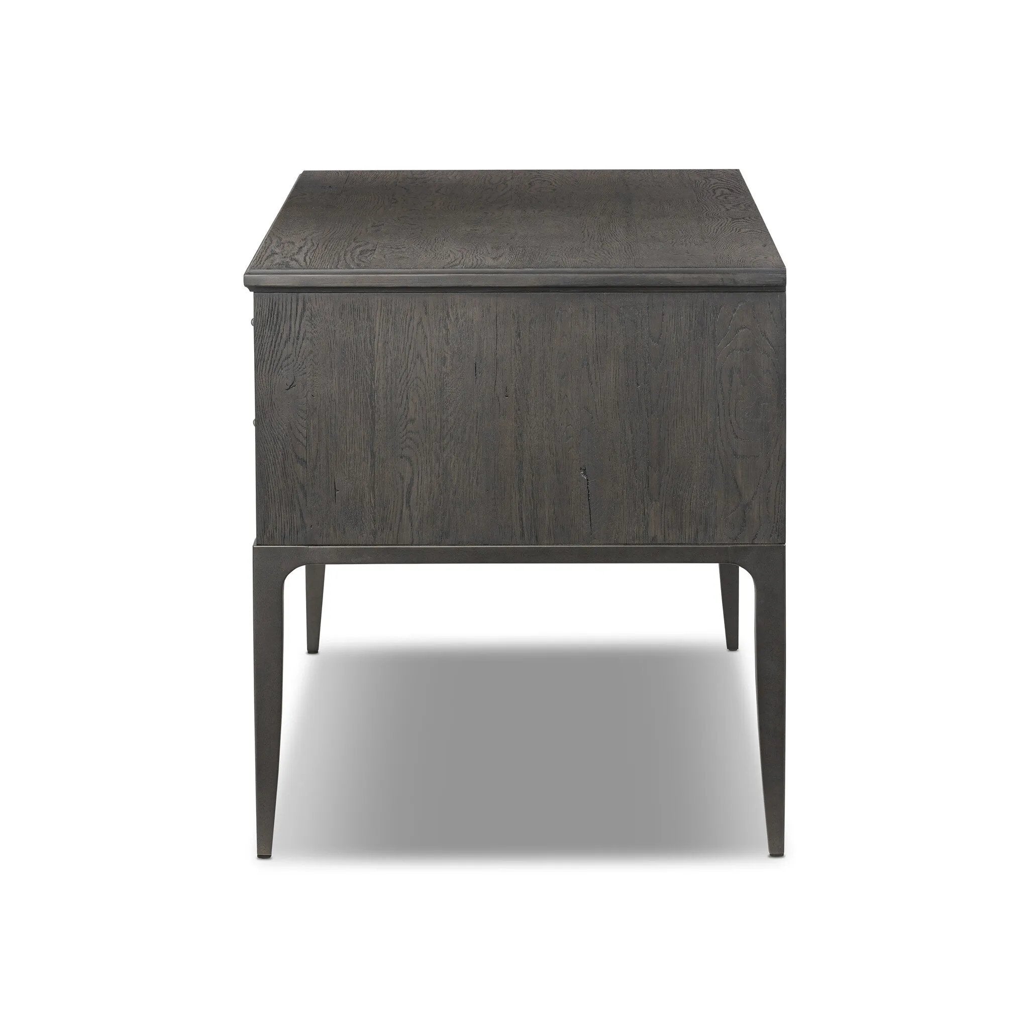 Baroque-period detailing gives this oak desk its  classic look. Made from worn black oak with metal ring pulls on its four drawers, as well as cabriole-like legs to soften the lines Amethyst Home provides interior design, new home construction design consulting, vintage area rugs, and lighting in the Washington metro area.