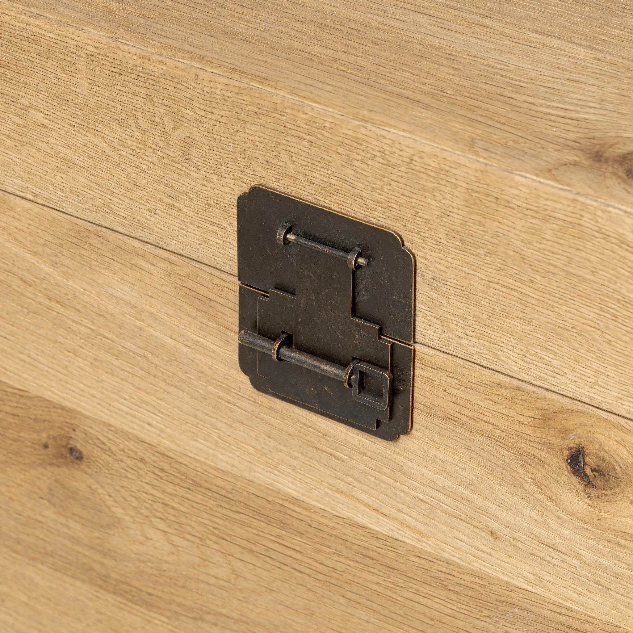 Inspired by classic Chinese antiques, this heritage-style trunk blends timeless design with modern functionality. Crafted from oak with a light, toasted finish, bronzed latch-and-key hardware adds a playful design detail Amethyst Home provides interior design, new home construction design consulting, vintage area rugs, and lighting in the Scottsdale metro area.