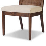 Featuring Antonia Savile Flax Cane Armless Dining Chair by Four Hands at Amethyst Home. Mixed materials refresh a retro style. Cane frames performance fabric seating with slight distressing, bringing more character to the seat. Performance fabrics are specially created to withstand spills, stains, high traffic and wear, ensuring long-term comfort and unmatched . Amethyst Home provides interior design, new home construction design consulting, vintage area rugs, and lighting in the Miami metro area.