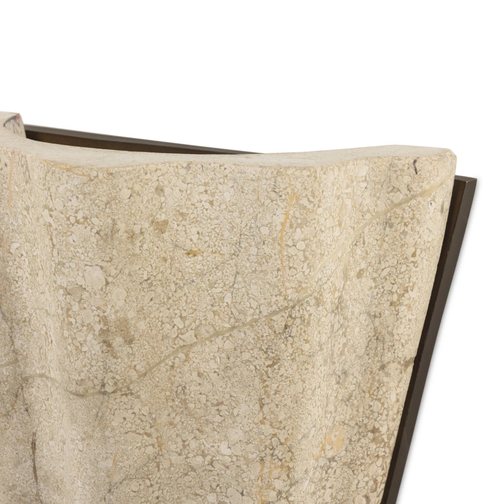 Turned Italian marble in a curved scalloped shape directs the light beautifully. The sculpted stone's organic tones and brushed brass iron back plating make for high-quality, décor-driven detail Amethyst Home provides interior design, new home construction design consulting, vintage area rugs, and lighting in the Boston metro area.