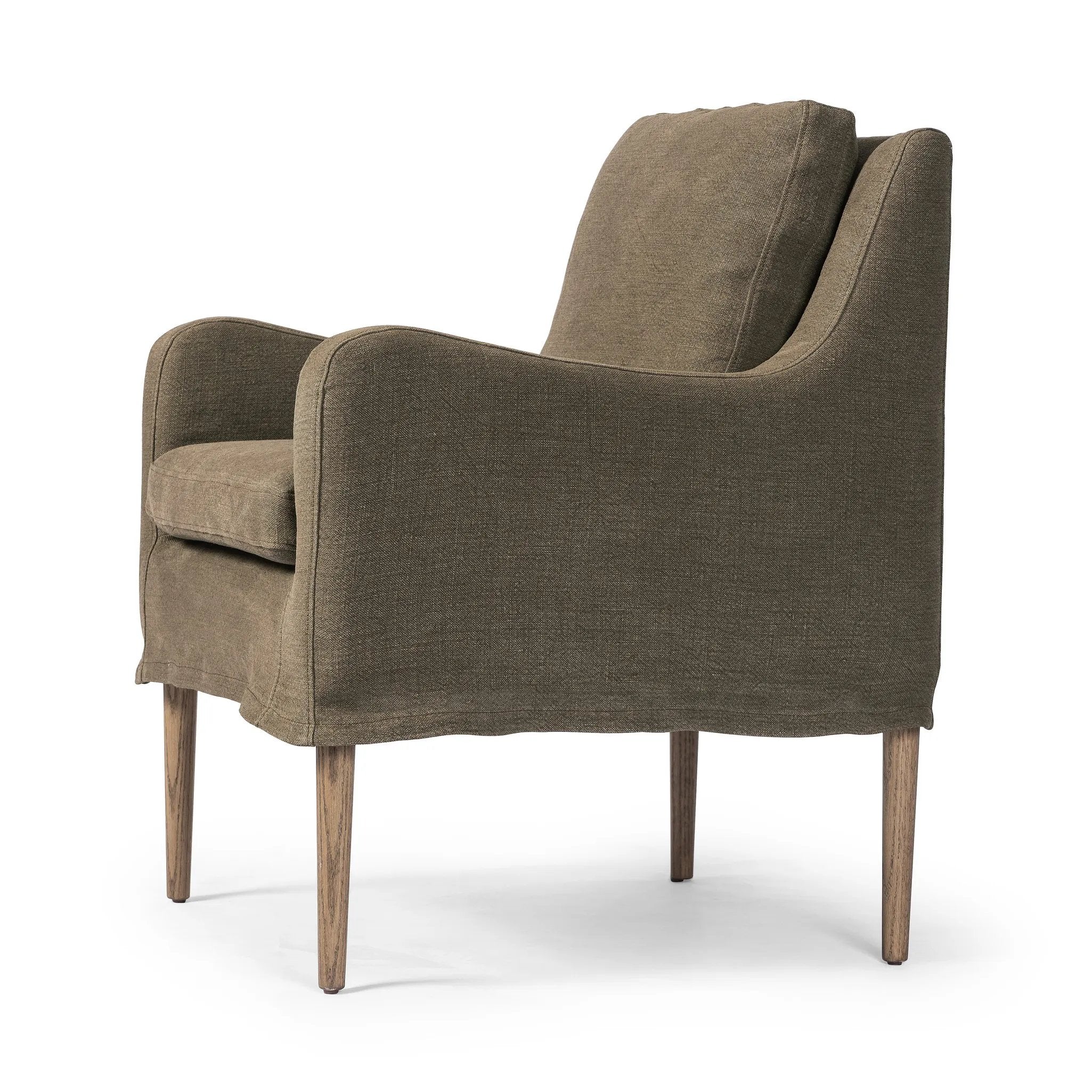 Heritage-inspired comfort. Sloping track arms are a study in playful forms, while the frame's fluid shape creates a simple, polished look. Tapered legs extend beyond a short skirt for a more relaxed style. Covered in 100% linen. A design collaboration by Amber Lewis and Four Hands. Amethyst Home provides interior design, new home construction design consulting, vintage area rugs, and lighting in the Miami metro area.