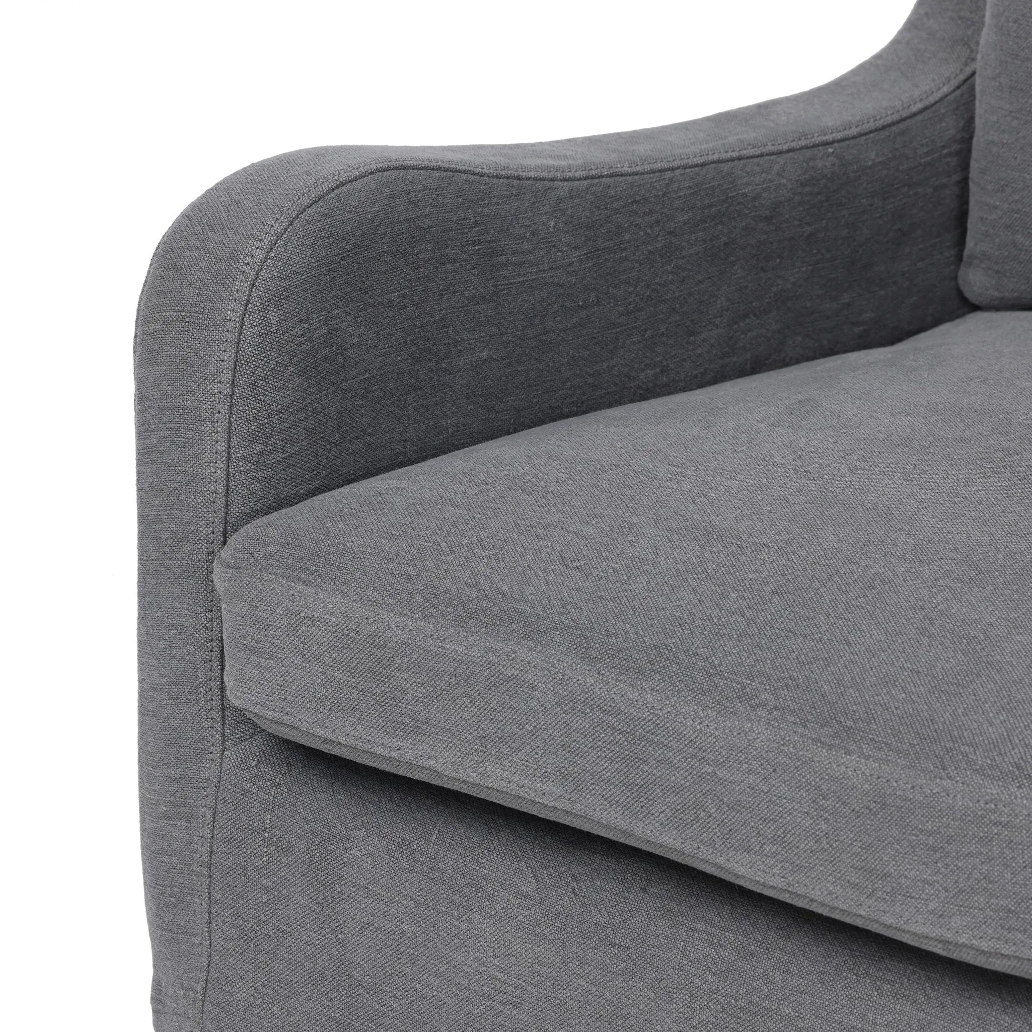 Heritage-inspired comfort. Sloping track arms are a study in playful forms, while the frame's fluid shape creates a simple, polished look. Tapered legs extend beyond a short skirt for a more relaxed style. Covered in 100% linen. A design collaboration by Amber Lewis and Four Hands. Amethyst Home provides interior design, new home construction design consulting, vintage area rugs, and lighting in the Houston metro area.