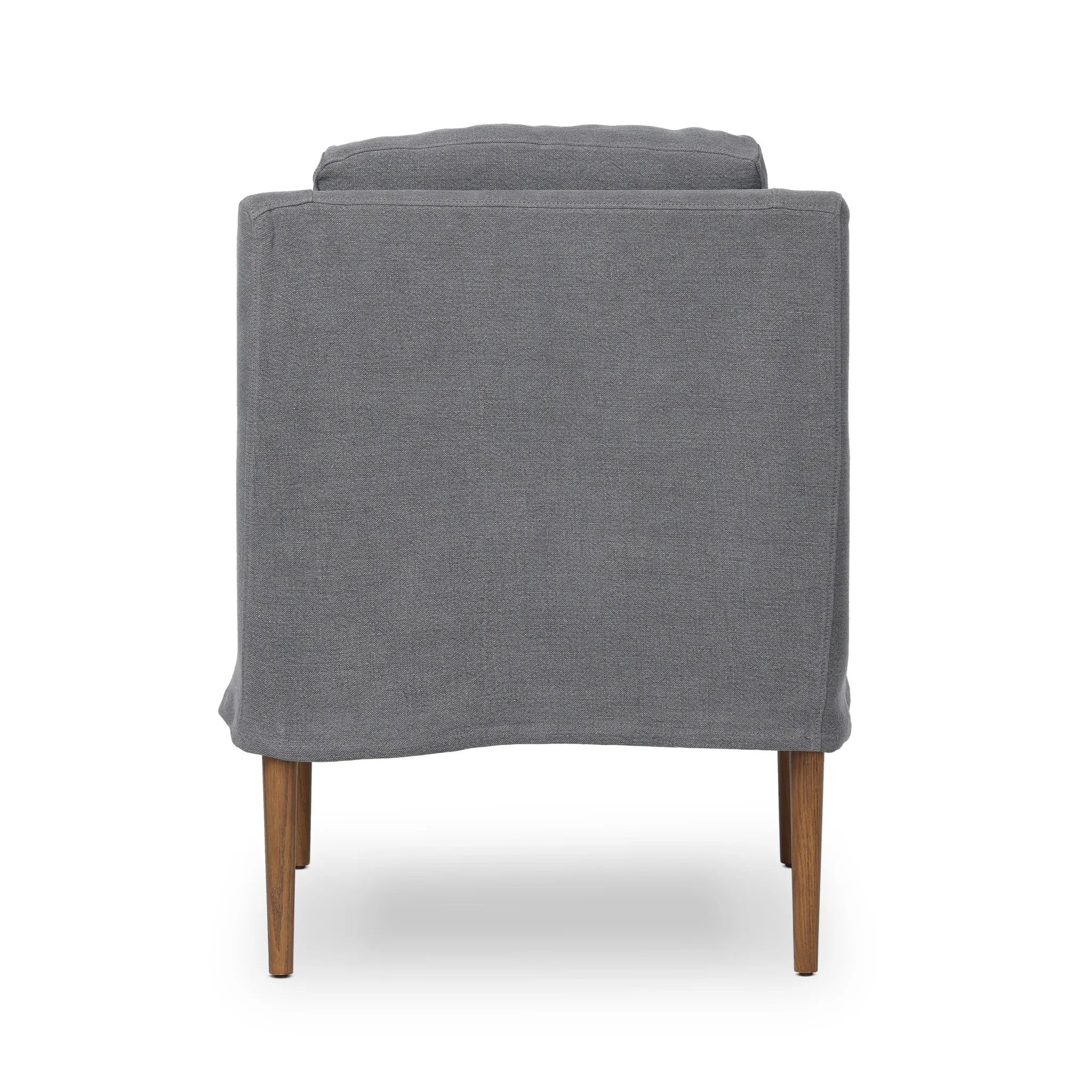 Heritage-inspired comfort. Sloping track arms are a study in playful forms, while the frame's fluid shape creates a simple, polished look. Tapered legs extend beyond a short skirt for a more relaxed style. Covered in 100% linen. A design collaboration by Amber Lewis and Four Hands. Amethyst Home provides interior design, new home construction design consulting, vintage area rugs, and lighting in the Monterey metro area.