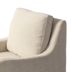 Heritage-inspired comfort. Sloping track arms are a study in playful forms, while the frame's fluid shape creates a simple, polished look. Tapered legs extend beyond a short skirt for a more relaxed style. Covered in 100% linen. A design collaboration by Amber Lewis and Four Hands. Amethyst Home provides interior design, new home construction design consulting, vintage area rugs, and lighting in the Newport Beach metro area.