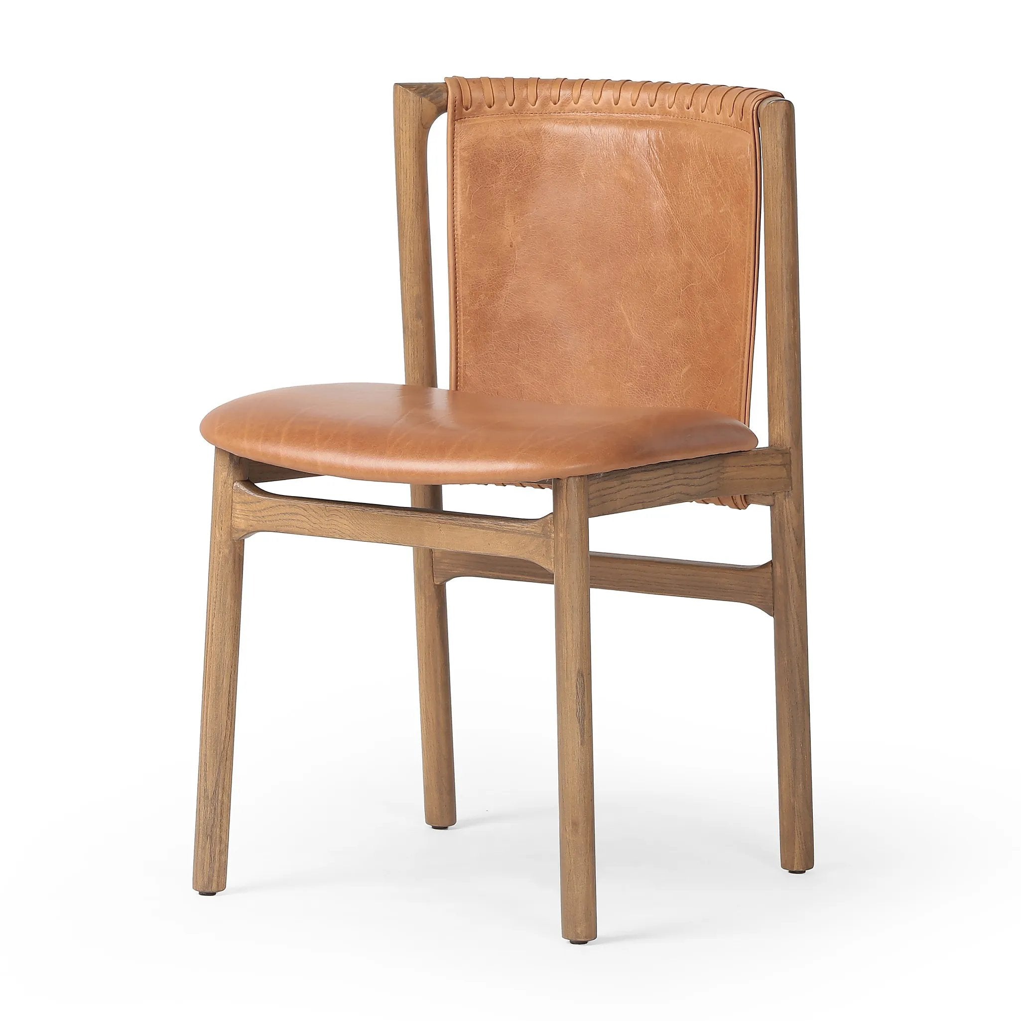 Featuring Baden Haven Tobacco Dining Chair by Four Hands at Amethyst Home. Midcentury-inspired with its minimalist wooden frame, this armless dining chair features a low back and float-like seat upholstered in tobacco top-grain leather exclusive to Four Hands. Leather wrap detailing for texture.Overall Dimensions: 19.75"w x 23.25"d x 32.25"hWeight : 14.99 l. Amethyst Home provides interior design, new home construction design consulting, vintage area rugs, and lighting in the Calabasas metro area.