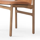 Featuring Baden Haven Tobacco Dining Chair by Four Hands at Amethyst Home. Midcentury-inspired with its minimalist wooden frame, this armless dining chair features a low back and float-like seat upholstered in tobacco top-grain leather exclusive to Four Hands. Leather wrap detailing for texture.Overall Dimensions: 19.75"w x 23.25"d x 32.25"hWeight : 14.99 l. Amethyst Home provides interior design, new home construction design consulting, vintage area rugs, and lighting in the San Diego metro area.