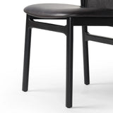 Featuring Baden Sonoma Black Dining Chair by Four Hands at Amethyst Home. Midcentury-inspired with its minimalist wooden frame, this armless dining chair features a low back and float-like seat upholstered in slightly distressed black top-grain leather exclusive to Four Hands. Leather wrap detailing for texture.Overall Dimensions: 19.75"w x 23.25"d x 32.25"hWe. Amethyst Home provides interior design, new home construction design consulting, vintage area rugs, and lighting in the Boston metro area.