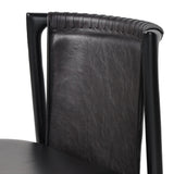 Featuring Baden Sonoma Black Dining Chair by Four Hands at Amethyst Home. Midcentury-inspired with its minimalist wooden frame, this armless dining chair features a low back and float-like seat upholstered in slightly distressed black top-grain leather exclusive to Four Hands. Leather wrap detailing for texture.Overall Dimensions: 19.75"w x 23.25"d x 32.25"hW. Amethyst Home provides interior design, new home construction design consulting, vintage area rugs, and lighting in the Houston metro area.
