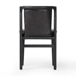 Featuring Baden Sonoma Black Dining Chair by Four Hands at Amethyst Home. Midcentury-inspired with its minimalist wooden frame, this armless dining chair features a low back and float-like seat upholstered in slightly distressed black top-grain leather exclusive to Four Hands. Leather wrap detailing for texture.Overall Dimensions: 19.75"w x 23.25"d x 32.25". Amethyst Home provides interior design, new home construction design consulting, vintage area rugs, and lighting in the San Diego metro area.