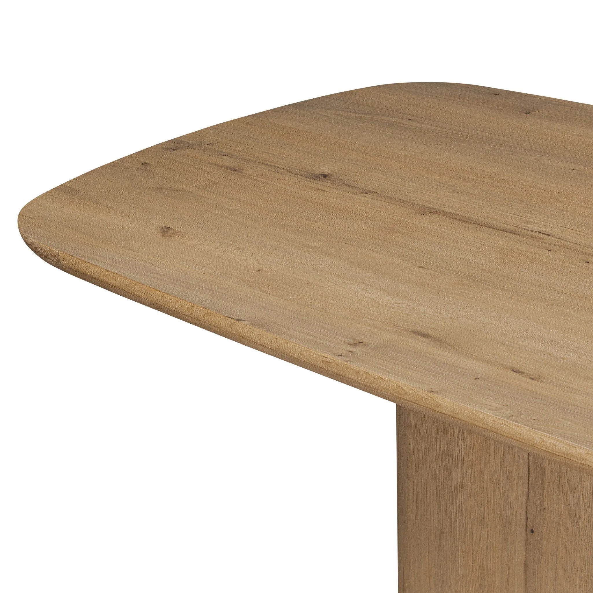 A stately dining style inspired by soft Brutalism. Crafted from aged smoked oak, a pair of matching pedestal bases features a delicate break between them, bringing a touch of lightness to such a substantial piece. A wide rectangular tabletop shapes arched sides that flow into rounded corners, finished off with bullnose edging Amethyst Home provides interior design, new home construction design consulting, vintage area rugs, and lighting in the Scottsdale metro area.