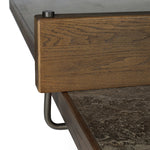 Fun meets flexibility. Two large slabs of warm grey marble, framed in rich oak, join together and sit atop the minimalist plinth bases of this dual-purpose ping pong table. The wooden "net" fastens to the table with custom gunmetal clamps, which can be easily removed for a dining table that seats 12 Amethyst Home provides interior design, new home construction design consulting, vintage area rugs, and lighting in the Houston metro area.