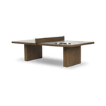 Fun meets flexibility. Two large slabs of warm grey marble, framed in rich oak, join together and sit atop the minimalist plinth bases of this dual-purpose ping pong table. The wooden "net" fastens to the table with custom gunmetal clamps, which can be easily removed for a dining table that seats 12 Amethyst Home provides interior design, new home construction design consulting, vintage area rugs, and lighting in the Portland metro area.