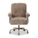 A large, comfort-driven desk chair of taupe shearling tops a 360-degree swivel, for a luxurious take on office styling Amethyst Home provides interior design, new home construction design consulting, vintage area rugs, and lighting in the Miami metro area.