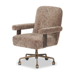 A large, comfort-driven desk chair of taupe shearling tops a 360-degree swivel, for a luxurious take on office styling Amethyst Home provides interior design, new home construction design consulting, vintage area rugs, and lighting in the San Diego metro area.