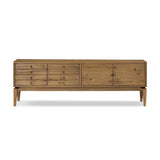 Featuring Bergstrom Warm Natural Oak Veneer Media Console by Four Hands at Amethyst Home. Light, natural oak reflects the New American inspiration behind this storage-driven console of warm, natural oak. Elevated on tapered legs with corner relief accents, its asymmetrical design offers storage for your media needs and more. Overall Dimensions: 84.00"w x 18.00. Amethyst Home provides interior design, new home construction design consulting, vintage area rugs, and lighting in the Austin metro area.