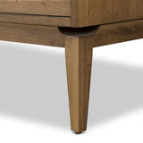 Featuring Bergstrom Warm Natural Oak Veneer Media Console by Four Hands at Amethyst Home. Light, natural oak reflects the New American inspiration behind this storage-driven console of warm, natural oak. Elevated on tapered legs with corner relief accents, its asymmetrical design offers storage for your media needs and more. Overall Dimensions: 84.00"w x 18.00". Amethyst Home provides interior design, new home construction design consulting, vintage area rugs, and lighting in the Miami metro area.