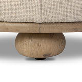 Featuring Bilbury Saxon Sand Ottoman by Four Hands at Amethyst Home. For an extra seat or propped feet, this welcoming ottoman features a subtly tapered shape and a rounded base with oak bun feet beneath. Crafted with soft foam cushioning and upholstered in a poly/wool blend fabric. Overall Dimensions: 22.00"w x 22.00"d x 18.50"h. Amethyst Home provides interior design, new home construction design consulting, vintage area rugs, and lighting in the Calabasas metro area.