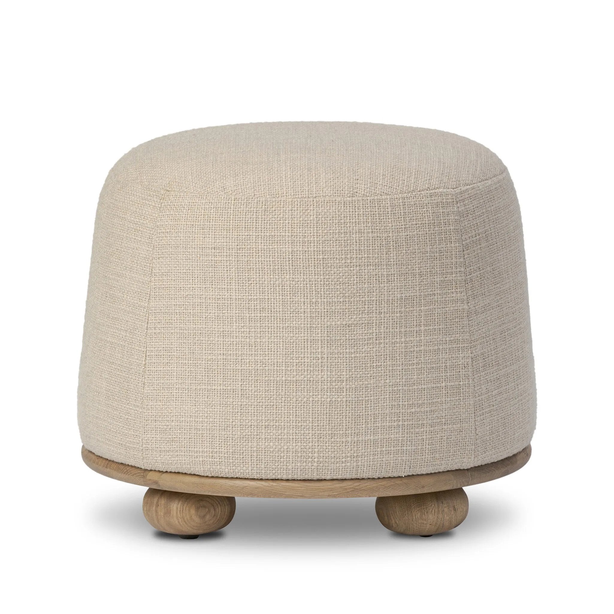 Featuring Bilbury Saxon Sand Ottoman by Four Hands at Amethyst Home. For an extra seat or propped feet, this welcoming ottoman features a subtly tapered shape and a rounded base with oak bun feet beneath. Crafted with soft foam cushioning and upholstered in a poly/wool blend fabric. Overall Dimensions: 22.00"w x 22.00"d x 18.50"h. Amethyst Home provides interior design, new home construction design consulting, vintage area rugs, and lighting in the Houston metro area.